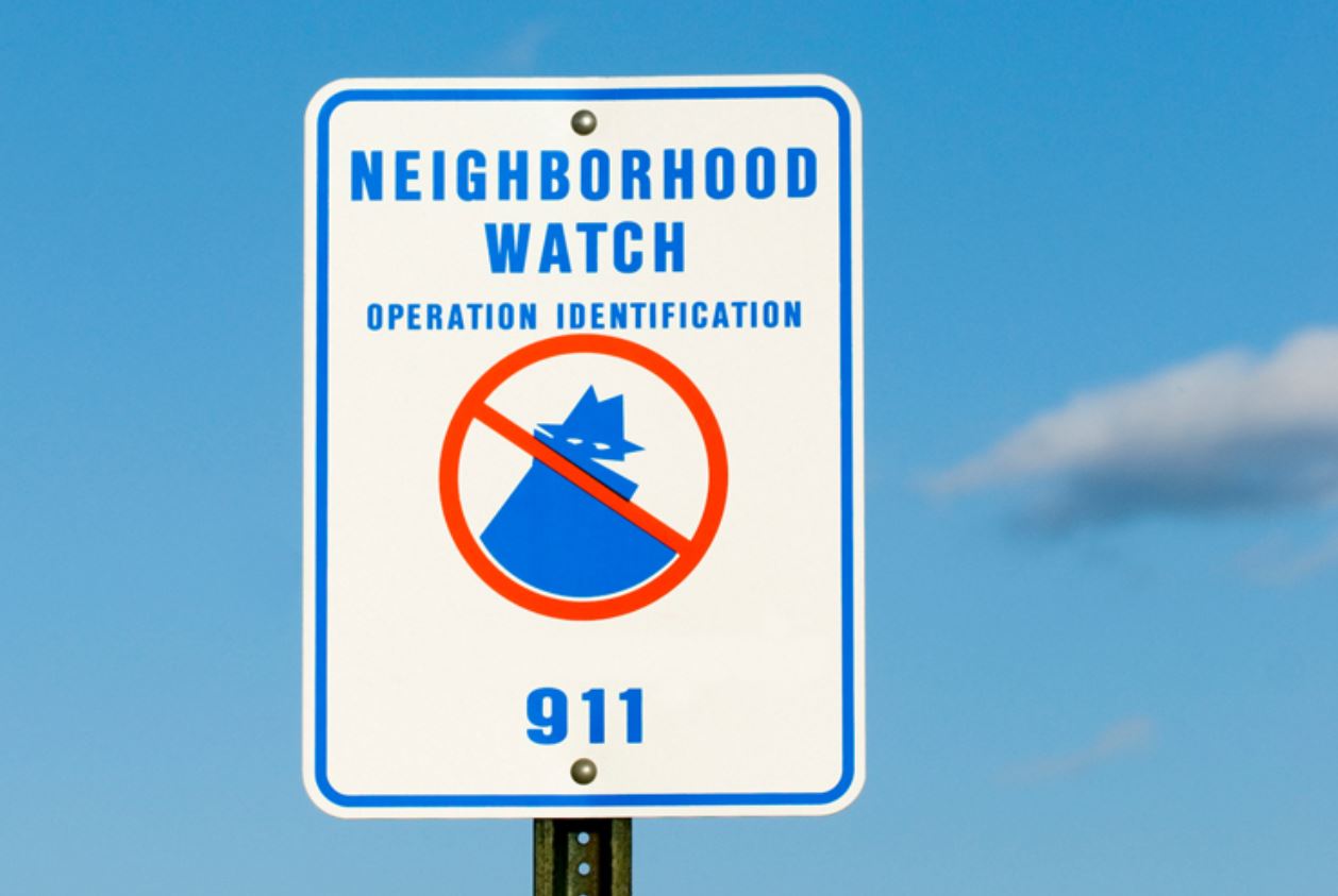 closeup of neighborhood watch sign board